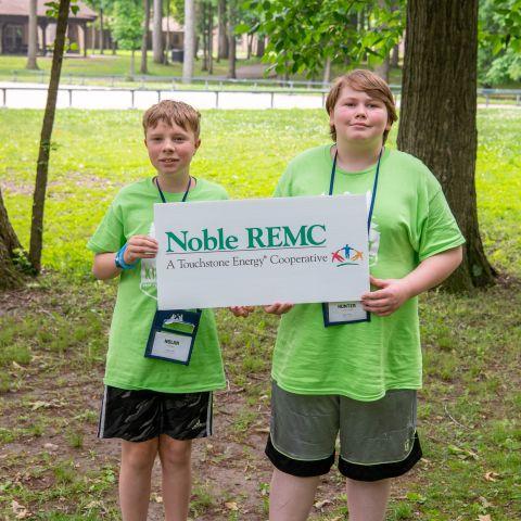 Camp Kilowatt campers pose with Noble REMC sign
