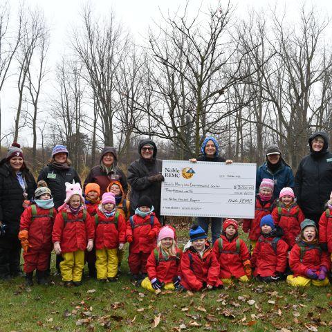 Merry Lea students accepting check