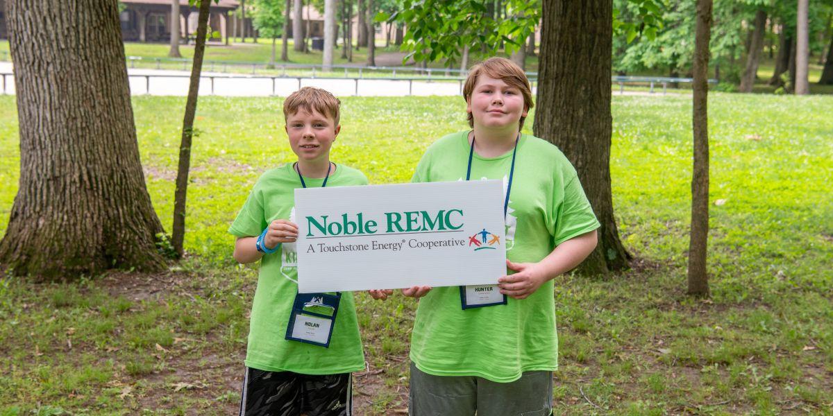Camp Kilowatt campers pose with Noble REMC sign