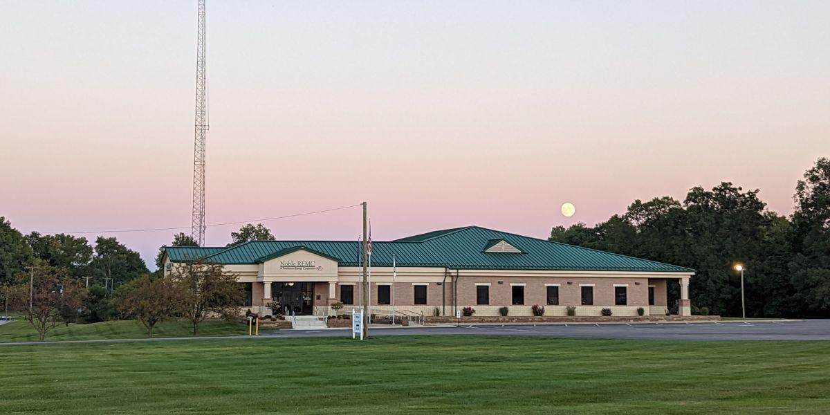 Noble REMC building at sunset